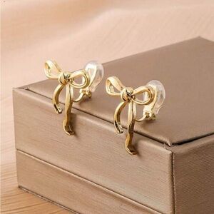 Elegant Gold Bow Clip On Earrings